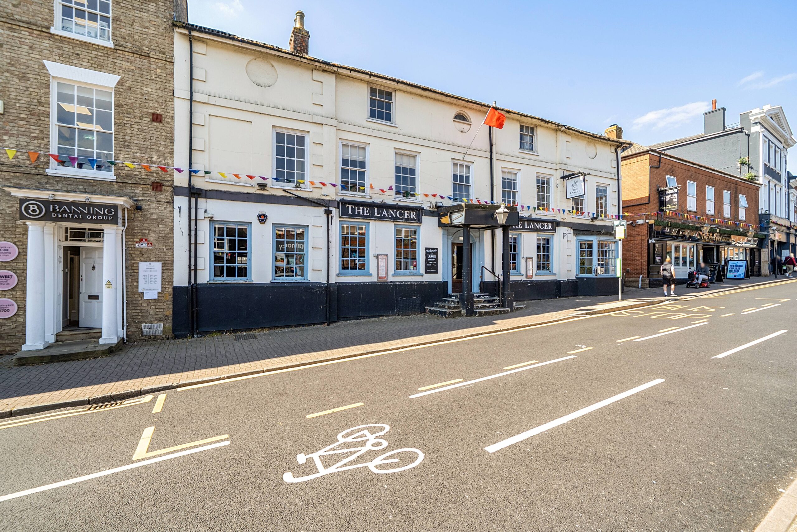 The property comprises a characterful public house arranged over two storeys, of traditional construction beneath a pitchedroof, presenting an attractive and well established street presence. The ground floor comprises of an open plan trade area served by a large timber panelled single bar servery with male and female customer WCs, staff WCs and stores. The trade kitchen is located to the rear. To the basement is cellarage and stores. First and second floors contain two manager's flats.  There is an external trade patio.