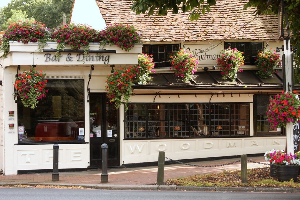 The property is a Grade II Listed two storey building of brick construction, under a pitched tiled roof. The ground floor comprises of an open plan split level trade area served by a single bar. To the first floor is a function room for circa 100 guests and has its own bar. To the rear is a large patioed beer garden which is fully covered by a remote-controlled retractable roof.
